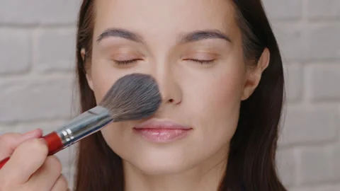 Discover the intricate process of applying makeup through a detailed beauty Stock Footage 305878922
