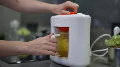Discover a Modern Kitchen Appliance to Make Quick Meal Preparation Effortlessly  Stock Footage 301436852