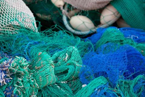 Discover a vibrant array of multicolor fishing nets and buoys adorning the Foto stock