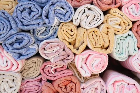 Discover a wide array of Colorful Rolled Fabrics featuring Various Textures and Stock Photos