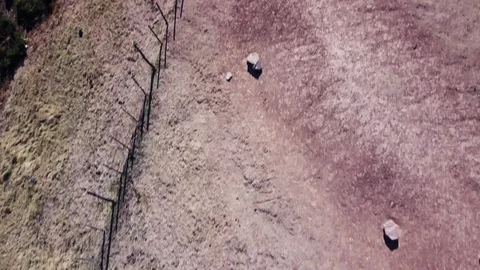 Discovering authentic mountain clay house and animals, TILT aerial shot Stock Footage 89858759
