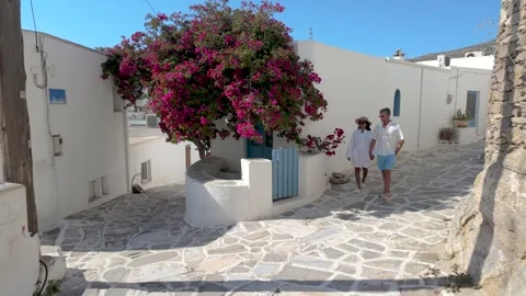 Discovering the charming streets of paros, greece under the bright cycladic sun Stock Footage 336528514