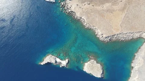 Discovering the Crystal-Clear Waters of Greece's Seaside: A Drone's Eye View Stock Footage 240280435