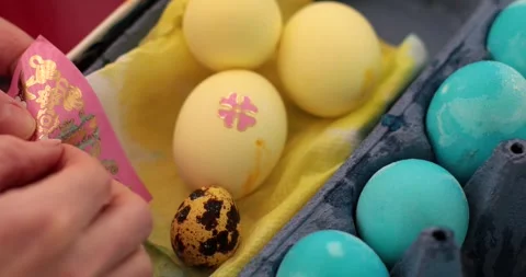 Discovering Easter eggs with stickers and exploring each step of egg painting in Stock Footage 306067755