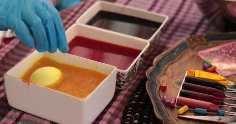 Discovering Easter eggs through the step of egg painting process with vibrant Stock Footage 306067741