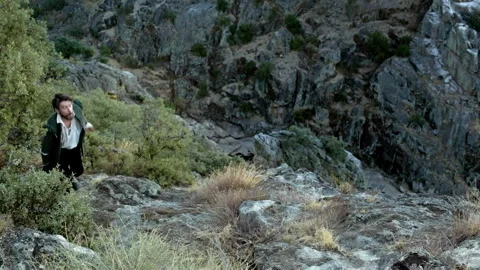 Discovering nature's beauty while exploring rocky terrain in the hills Stock Footage 327965232