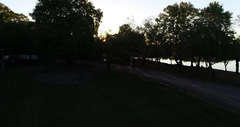 Discovering panoramic view of river and kayak rowing lonely at orange sunset 스톡 동영상 119083895