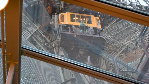 Discovering Paris: footage at the Eiffel Tower of one of the elevators that take Stock Footage 201500043