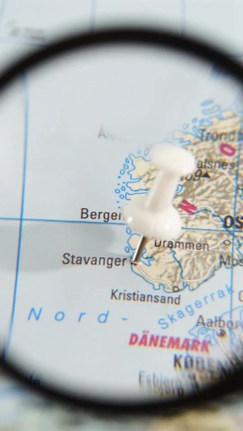 Discovering Stavanger on a paper map using a magnifying glass Stock Footage 340078970