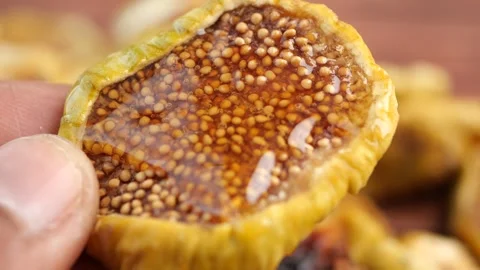 Discovering the sweetness of dried fig slices Stock Footage 317527778