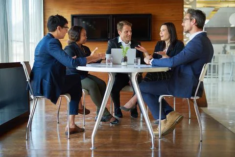 Discussing the best way forward. Shot of a group of corporate businesspeople  Stock Photos