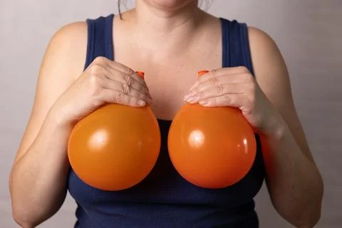 Discussing Breast Changes After Pregnancy and Aging, With Surgical Improvement Stock Photos