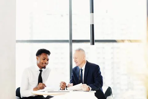 Discussing budget implementation in office Stock Photos