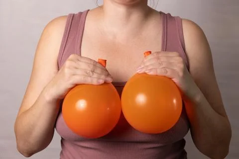 Discussing Changes in Breast Appearance After Pregnancy and Aging With Plas.. Stock Photos