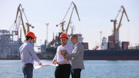 Discussing of contractors, shipyard background Stockbeeldmateriaal 122644885