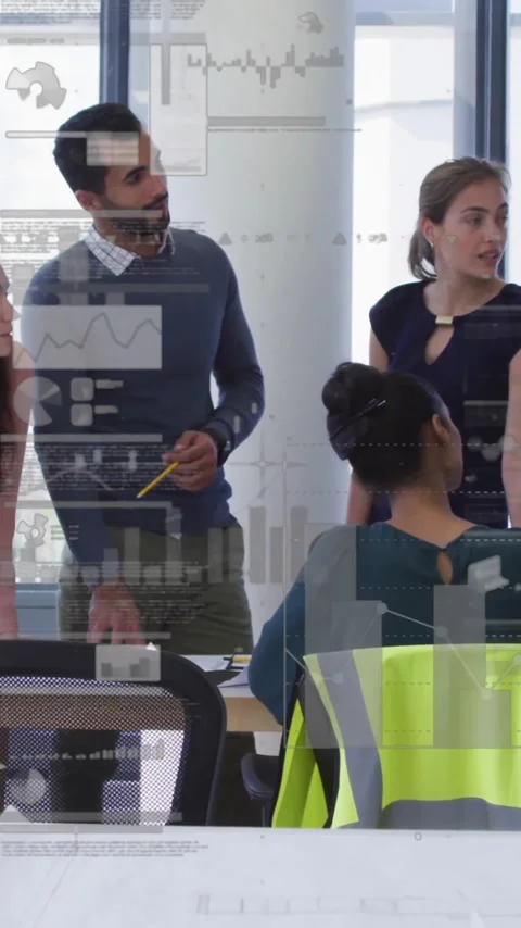 Discussing data analytics with charts overlay, business team collaborating in Stock Footage 344244832