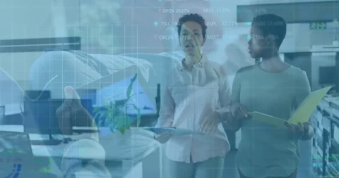 Discussing data with financial statistics overlay, business professionals in Stock Footage 328015835