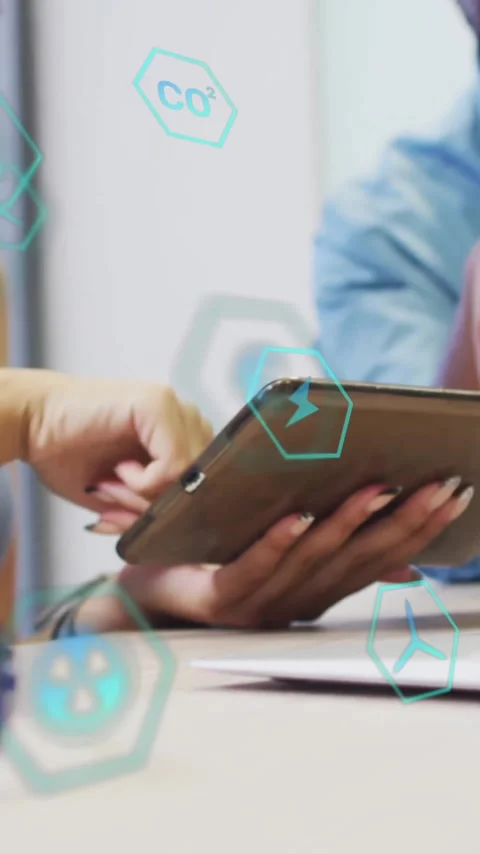 Discussing digital data, two people using tablet with animation overlay in Stock Footage 344244785