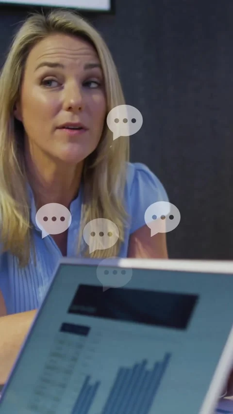 Discussing documents and data, colleagues in business meeting using laptops Stock Footage 344403743