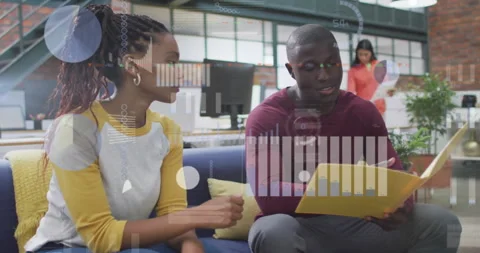 Discussing documents, colleagues in office with data processing animation over Stock Footage 308901831