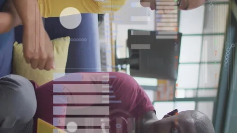 Discussing documents, colleagues in office with data processing animation over Stock Footage 312510066