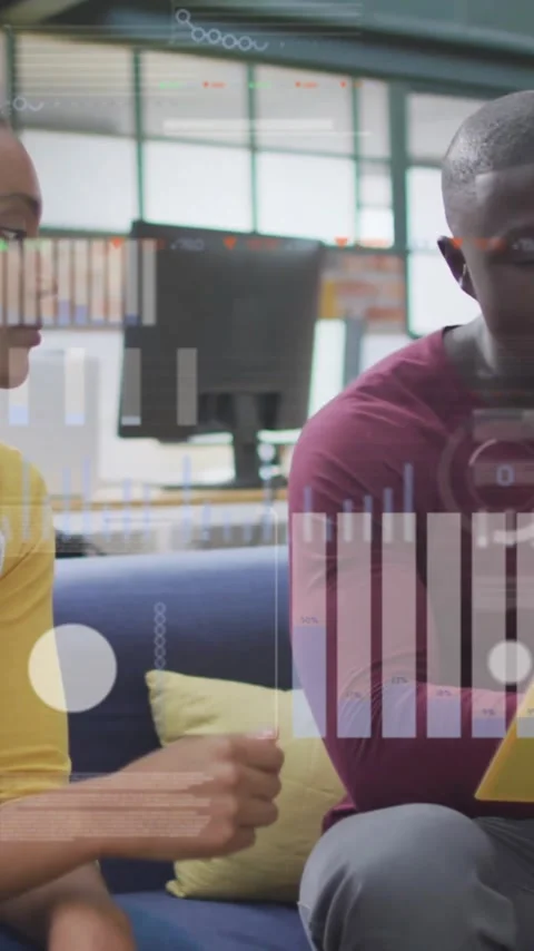 Discussing documents, colleagues in office with data processing animation over Stock Footage 320280285