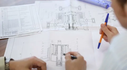 Discussing engineering drawing Stock Footage 62978646