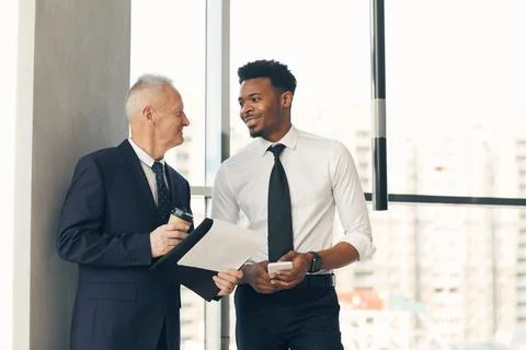 Discussing project implementation with young PR manager Stock Photos