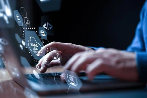 Discussing software as a service in a modern workspace with a laptop and cloud Stock Photos