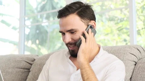 Discussing work on my sofa is really relaxing. Stock Footage 101890652