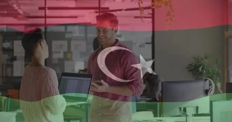 Discussing work in office, two colleagues with Azerbaijan flag animation overlay Stock Footage 306265574