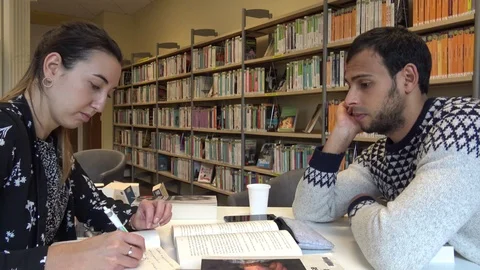 Discussion Between Two Persons In a Library Stock Footage 123053193