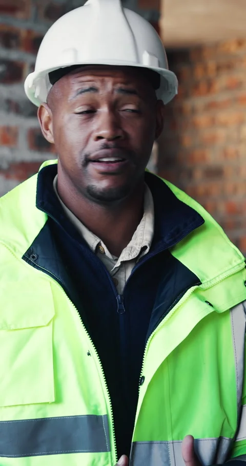 Discussion, black man and construction worker on site with planning for Stock Footage 337021524