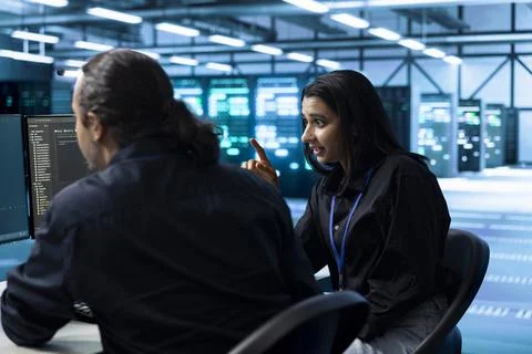 Discussion, collaboration and problem solving with coworkers in data center Stock Photos
