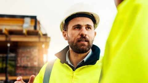 Discussion, engineering or men on construction site for building, inspection or Stock Photos