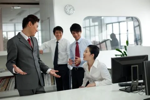 Discussion in front of the computer Stock Photos