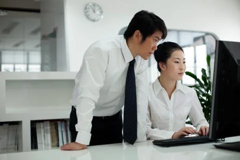 Discussion in front of the computer Stock Photos