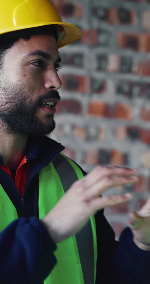 Discussion, man and construction worker on site with building, repairs or Stock Footage 337021917