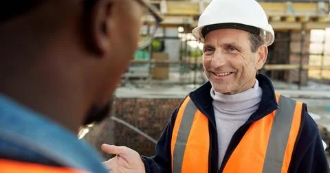 Discussion, men and construction worker with manager in site with planning for Stock Photos