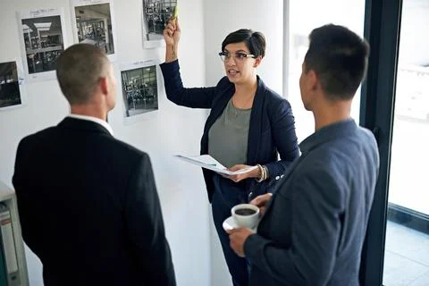 Discussion, photograph and problem solving with business people in workplace for Foto stock