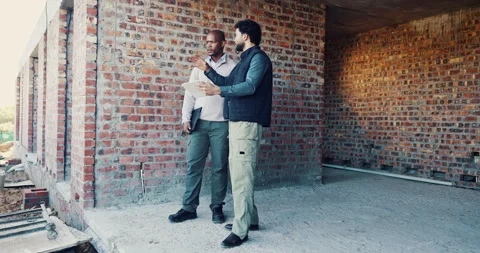 Discussion, team or men with tablet at construction site, renovation ideas or Stock Footage 336777756