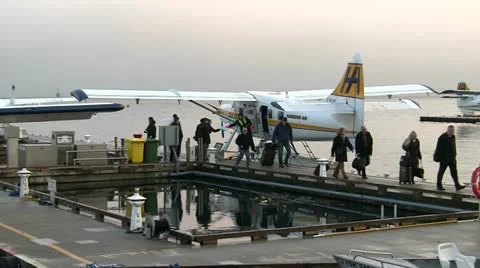 Disembarking from Seaplane In Single File Stock Footage 19126171