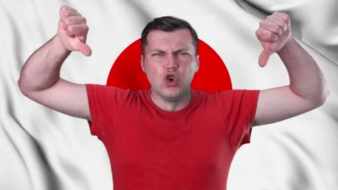 A disgruntled man against the background of the flag of Japan, Stock Footage 150164391