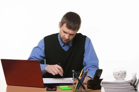 Disgruntled manager checks graphs in documents on a white background Stock Photos