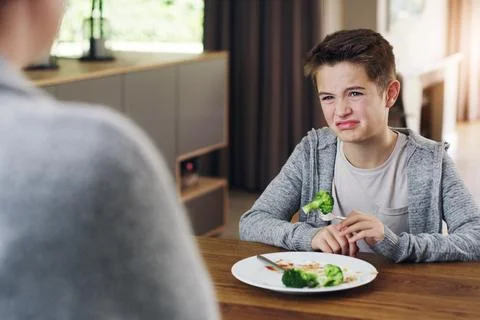 Disgust, vegetable and fear with child and broccoli for nutrition, health and Stock Photos