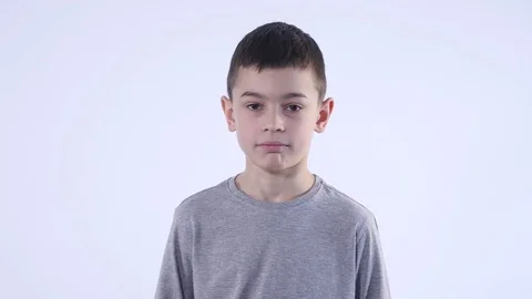 Disgusted boy. Negative human emotion on white background Stock Footage 73066216