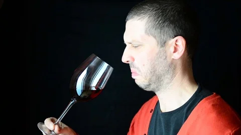 Disgusted caucasian sommelier tastes red wine and doesn't like it at all! Stock Footage