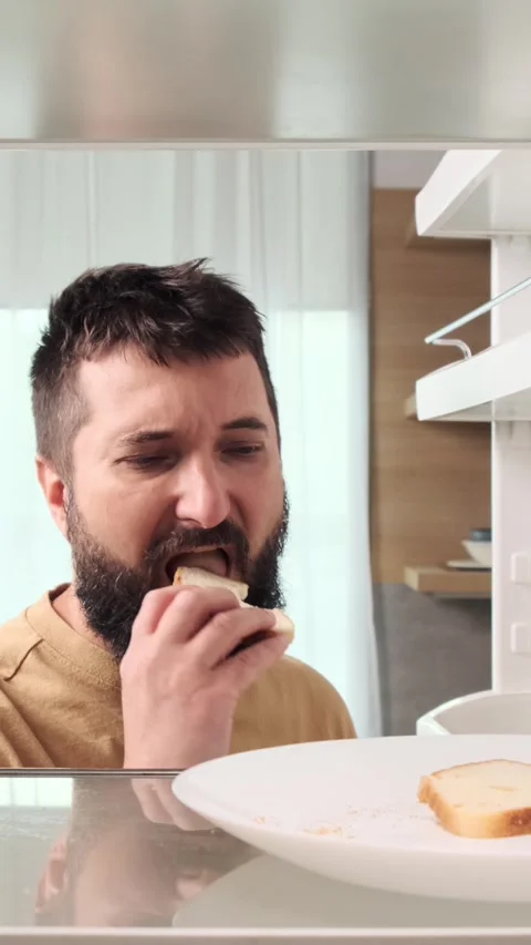 Disgusted Man Bite Dry And Rotten Bread From Fridge Stock Footage 282341647
