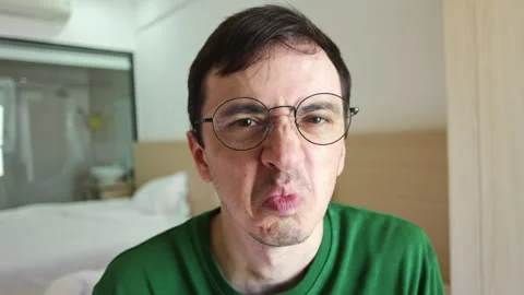 Disgusted man making a grimace face Stock Footage 337366899