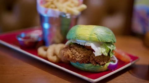 Disgusting Abstract Green Chicken Burger Bun With Chips And Onion Rings Stock Footage 237694168